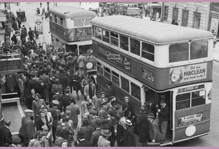 London at War, 1942 Crowds of men and women, including servicemen, queue for buses in the Strand. Two buses, the number 13 to Golders Green and number 15 to Ladbroke Grove can be seen in the foreground as passengers jump on and off. Just visible in the background are the base of Nelson's Column in Trafalgar Square (right) and Admiralty Arch (left).