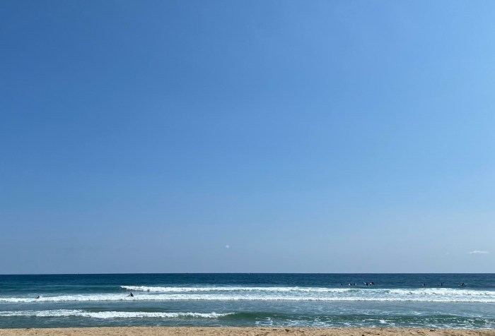 A view out onto the sea and a cloudless sky